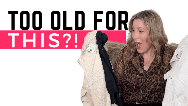 Fashion Finds: Shopping at Trendy Stores for Women Over 40 1 A woman with blonde hair sits on a couch, holding up two fashion finds and looking surprised. Text above her reads, Too Old For This?! This stylish moment highlights trendy stores for women over 40. She wears a leopard print top.